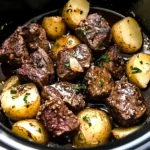 crockpot garlic butter beef bites with potatoes