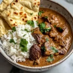 Creamy Coconut Curry Beef with Rice and Garlic Naan